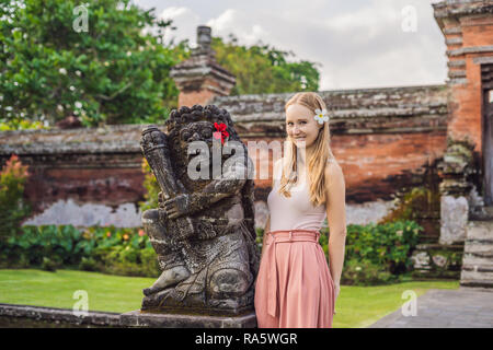 Young woman tourist in Traditional balinese hindu Temple Taman Ayun in Mengwi. Bali, Indonesia Stock Photo