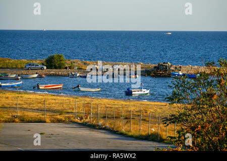 Small fishing boats anchored off shore in the Aegean Sea, Greece Stock Photo