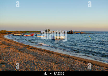 Small fishing boats anchored off shore in the Aegean Sea, Greece Stock Photo