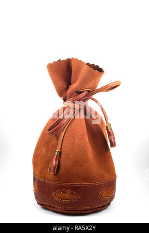brown suede pouch on white background, vertical Stock Photo