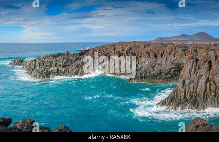 The rugged volcanic coastal rocks of Los Hervideros on the Islands of Lanzarote, pounded by the ferocious Atlantic Sea Stock Photo