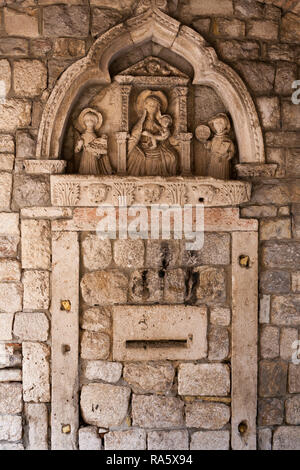 Walking around the impressive and labyrinth streets of history inside the walls of the Old Town of Kotor in Montenegro Stock Photo