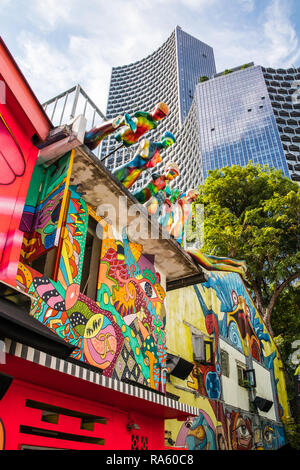 Singapore - 22nd December 2018: Haji lane wall murals with modern office block in the background, This is in the Kampong Glam area Stock Photo