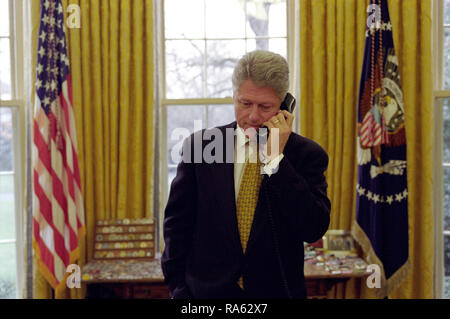 3/20/1998 - President William J. Clinton talking on the telephone with Governor Zell Miller of Georgia Stock Photo