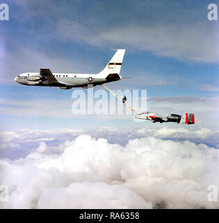 1978 - An air-to-air left side view of an A-10 Thunderbolt II aircraft being refueled by a KC-135A Stratotanker aircraft.  The Advanced Aerial Refueling Boom is attached between the two aircraft. Stock Photo