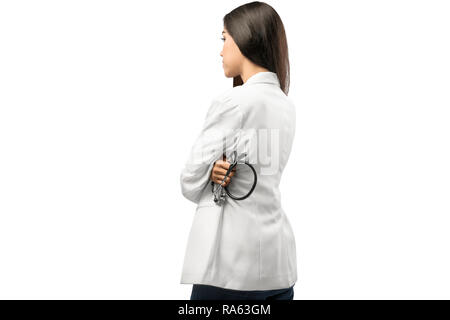 Rear view of asian doctor woman in white coat holding stethoscope standing isolated over white background