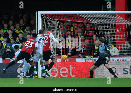 London, UK. 1st Jan, 2018. Julian Jeanvier of Brentford (23) scores his team's first goal. EFL Skybet championship match, Brentford v Norwich City at Griffin Park on New Years Day, Tuesday 1st January 2019 . this image may only be used for Editorial purposes. Editorial use only, license required for commercial use. No use in betting, games or a single club/league/player publications. pic by Steffan Bowen/Andrew Orchard sports photography/Alamy Live news Credit: Andrew Orchard sports photography/Alamy Live News Stock Photo