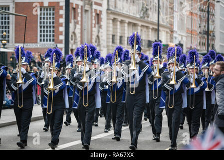 London, UK.  1 January 2019.   The theme of the parade this year was “London Welcomes the World”. With thousands of performers from a multitude of different countries and cultures from all around the world parade through central  London. Acts included the Downers Grove North High School Trojan Marching Band from Illinois, USA  Credit: Ilyas Ayub / Alamy Live News Stock Photo