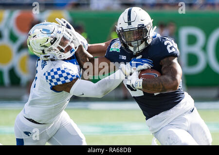 Penn State running back Miles Sanders hurdles Wisconsin's Faion Hicks ...