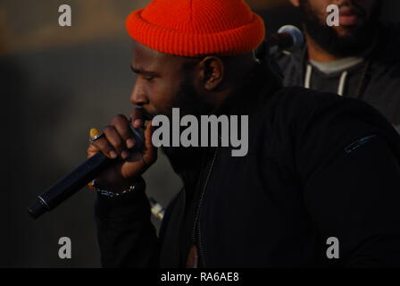 Oakland, California, USA. 1st Jan, 2019. Karega Bailey of Sol Development performs at a vigil for Oscar Grant, at the Fruitvale BART station in Oakland, California, 10 years after he was killed by a police officer. Credit: Scott Morris/Alamy Live News Stock Photo