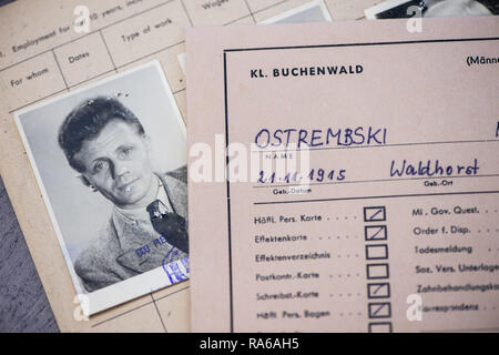 Bad Arolsen, Germany. 11th Dec, 2018. A file card of the prisoner Ostremski in the concentration camp Buchenwald is on a table at the International Tracing Service (ITS). The ITS is an archive and documentation centre on Nazi persecution and the liberated survivors. (to dpa 'International Tracing Service ITS' from 02.01.2019) Credit: Swen Pförtner/dpa/Alamy Live News