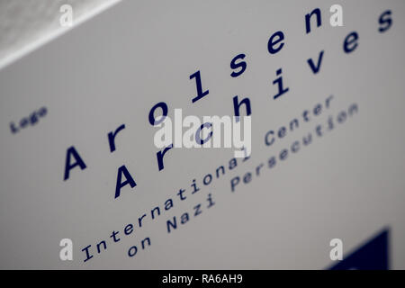 Bad Arolsen, Germany. 11th Dec, 2018. The new logo with the words 'Arolsen Archives' can be seen in a hallway of the International Tracing Service (ITS) office building. The ITS is an archive and documentation centre on Nazi persecution and the liberated survivors. (to dpa 'International Tracing Service ITS' from 02.01.2019) Credit: Swen Pförtner/dpa/Alamy Live News