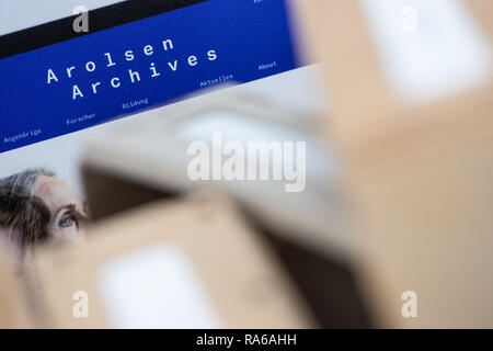 Bad Arolsen, Germany. 11th Dec, 2018. The new logo with the words 'Arolsen Archives' can be seen on a printout of a website in the International Tracing Service (ITS). The ITS is an archive and documentation centre on Nazi persecution and the liberated survivors. Credit: Swen Pförtner/dpa/Alamy Live News