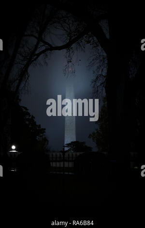 District of Columbia, USA. 2nd Dec, 2018. Rain clouds cover the top of the Washington Monument in Washington, DC on December 2, 2018. Credit: Alex Edelman/ZUMA Wire/Alamy Live News Stock Photo