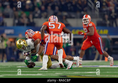 December 29, 2018 - Arlington, Texas, U.S - December 29, 2018 - Arlington, Texas, U.S. - Notre Dame Fighting Irish tight end Alize Mack (86) is tacked by Clemson Tigers safety Isaiah Simmons (11) in the College Football Playoff Semifinal at the Goodyear Cotton Bowl Classic between the Notre Dame Fighting Irish and the Clemson Tigers at AT&T Stadium, Arlington, Texas. Clemson won 30-3 to advance to the National Championship game. (Credit Image: © Adam Lacy/ZUMA Wire) Stock Photo