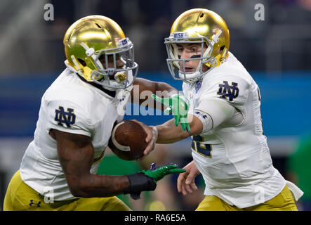 Arlington, Texas, USA. 29th Dec, 2018. December 29, 2018 - Arlington, Texas, U.S. - Notre Dame Fighting Irish quarterback Ian Book (12) warms up before the College Football Playoff Semifinal at the Goodyear Cotton Bowl Classic between the Notre Dame Fighting Irish and the Clemson Tigers at AT&T Stadium, Arlington, Texas. Clemson won 30-3 to advance to the National Championship game. Credit: Adam Lacy/ZUMA Wire/Alamy Live News Stock Photo