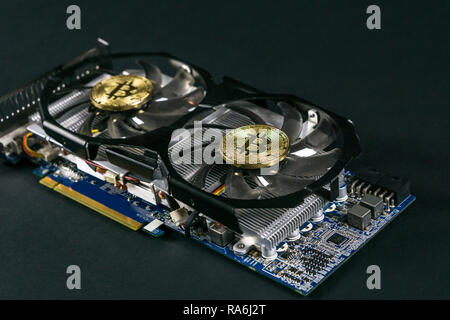 Bitcoin coin on GPU, Cryptocurrency Mining Using Graphic Cards Stock Photo