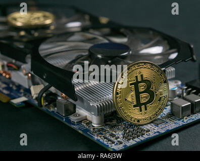 Bitcoin coin on GPU, Cryptocurrency Mining Using Graphic Cards Stock Photo