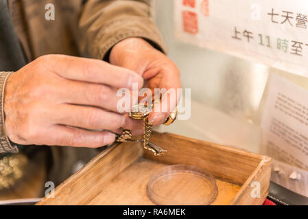 A watchmaker working on the street in San Francisco, California, USA Stock Photo