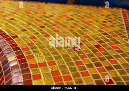 Colorful golden ceramic mosaic using in pool background Stock Photo