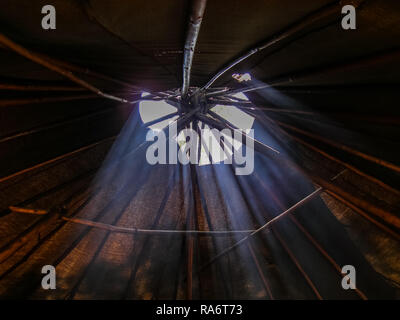 Light makes its way through the hole in the yurt. Igloo, the traditional home of the northern tribes Stock Photo