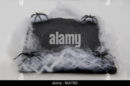 blackboard dish decorated with spiders and spider web Stock Photo