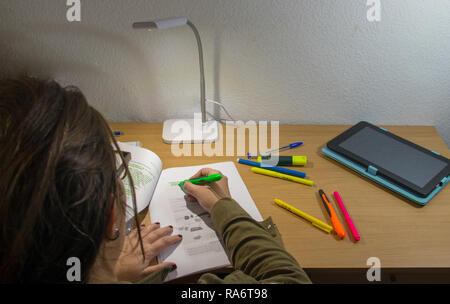 study table while underlining the notes Stock Photo - Alamy