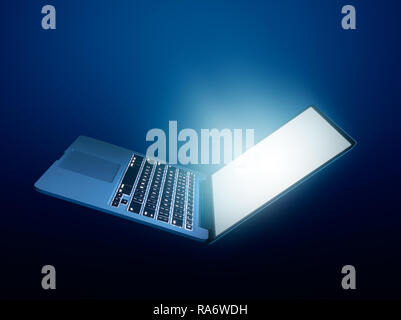 Open laptop with glowing light on dark background Stock Photo
