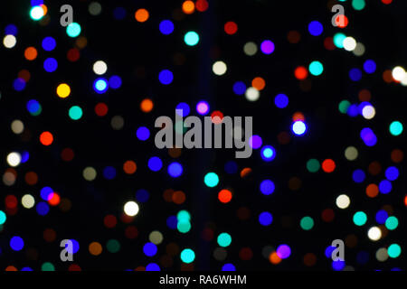 Light circles, bokeh, rainbow, christmas lights, dark background Stock Photo