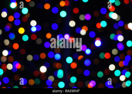 Light circles, bokeh, rainbow, christmas lights, dark background Stock Photo