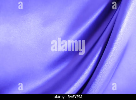 Smooth elegant wavy blue silk or satin luxury cloth fabric texture, abstract background design. Stock Photo