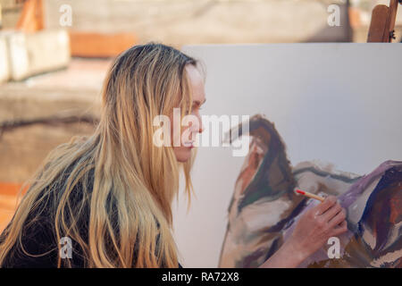 Young woman paint artist drawing at home roof Stock Photo