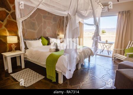 Double bed, Bedroom, Elegant Desert Lodge, Sesriem, Namibia Stock Photo