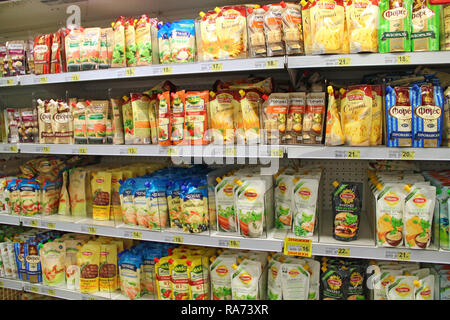 Mayonnaise in shop. Shelves of supermarket with wide assortment of sauces and mayonnaise. Sauce and mayonnaise on store shelves. Shop of sauces and ma Stock Photo