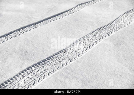 Tire tracks in newly fallen snow Stock Photo
