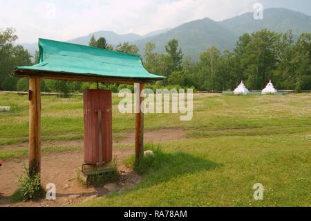 Ritual wooden drum in Datsan, Buddhist university monastery, Arshan, Tunkinsky District, Republic of Buryatia, Siberia Stock Photo