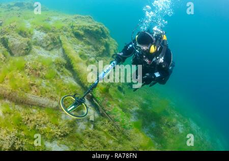 Diver with the metal detector looking for a treasure under water, Lake Baikal, Siberia, Russia, Eurasia Stock Photo