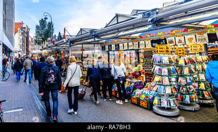 Souvenir shops at the famous Bloemenmarkt (Flower Market) along the Singel Canal in the city center of Amsterdam in the Netherlands Stock Photo