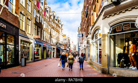 The Kalverstraat, a famous shopping street in the center of the old city of Amsterdam in the Netherlands Stock Photo
