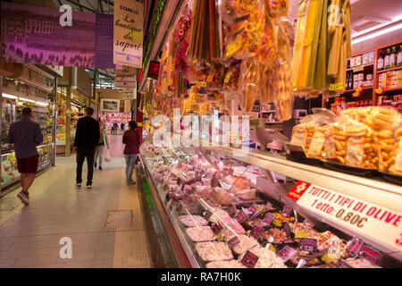 An Italian butcher vendor inside the central market in Torino, Italy Stock Photo