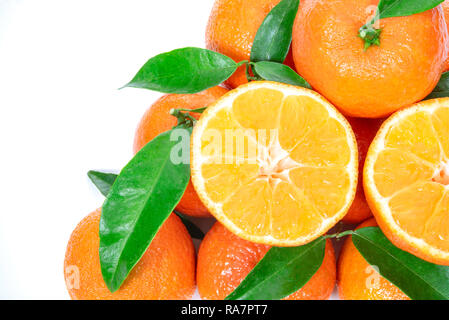 Tropical fruit composition - group of fresh oranges or tangerines  isolated on a white background Stock Photo