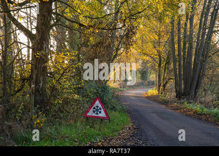 Ice on road traffic warning sign in the Cheshire countryside Stock Photo