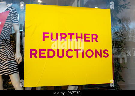 Further reductions sale sign on shop window UK Stock Photo