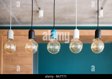 Edison retro lamps. Incandescent bulbs on grey wall background in loft. Concept of vintage style Stock Photo