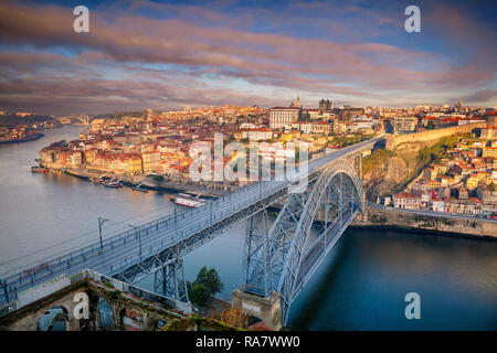 Porto, Portugal. Aerial cityscape image of Porto, Portugal with the Douro River and the Luis I Bridge during sunrise. Stock Photo