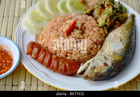 spicy fried rice with shrimp paste sauce and mackerel on dish Stock Photo