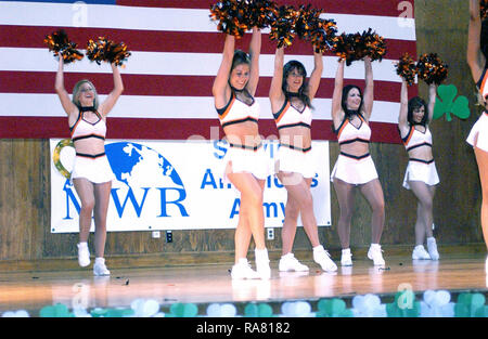 Cheerleaders from the National Football League’s (NFL) Cincinnati Bengals, Football Team perform on stage for North Atlantic Treaty Organization (NATO) military and civilian personnel at Camp Butmir, Bosnia and Herzegovina (BIH), during Operation JOINT FORGE. Stock Photo