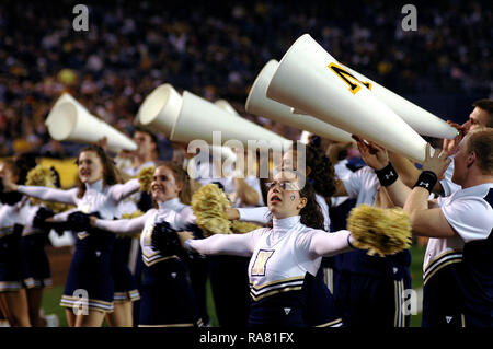 2005 - US Naval Academy (USNA) Midshipmen cheerleaders display their team spirit during the Poinsettia Bowl. USNA defeated Colorado State 51-30 at the inaugural Poinsettia Bowl at San Diego’s Qualcomm Stadium. Stock Photo