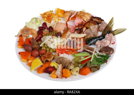 Food waste which remain after  cooking  on white  plate.  Isolated macro studio shot. The power of humanity in the future concept Stock Photo