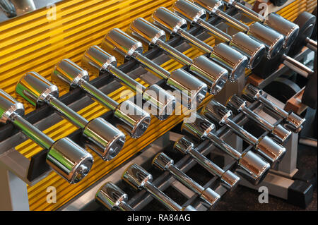 metal dumbbells on a stand Stock Photo
